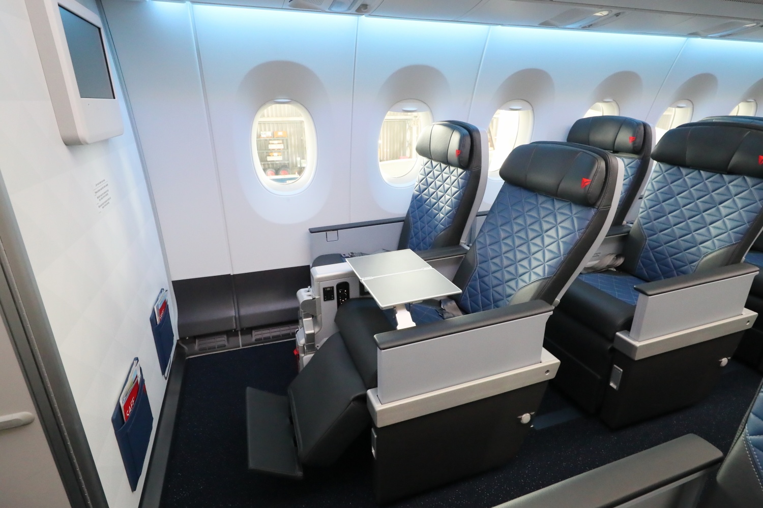 Premium economy airline cabin with comfortable seating